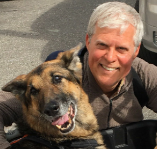 Dog and man smiling together